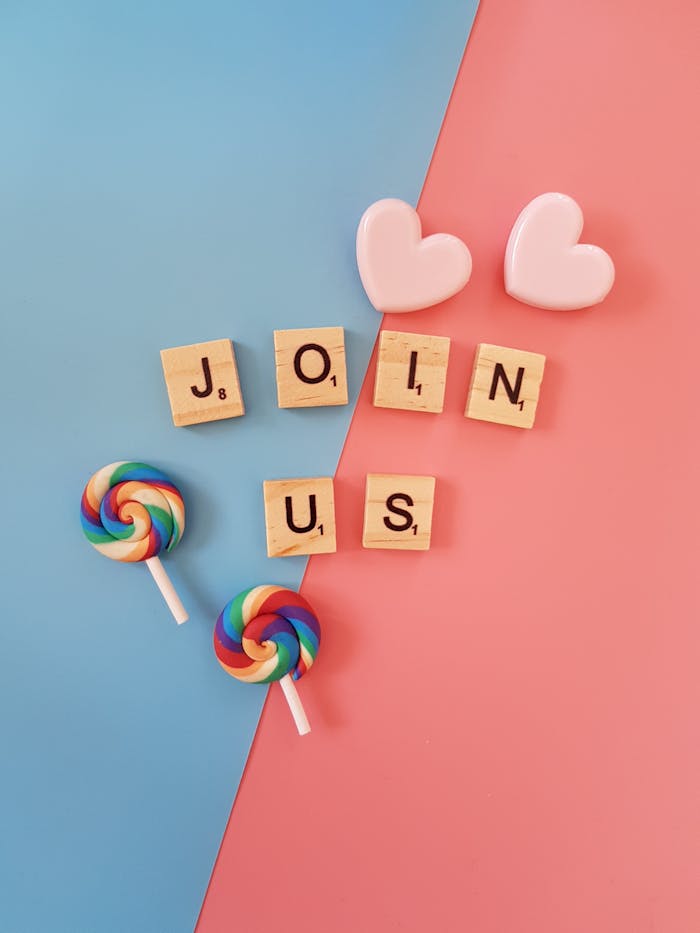about-us Bright 'Join Us' call-to-action with colorful lollipops and hearts on a pastel background.